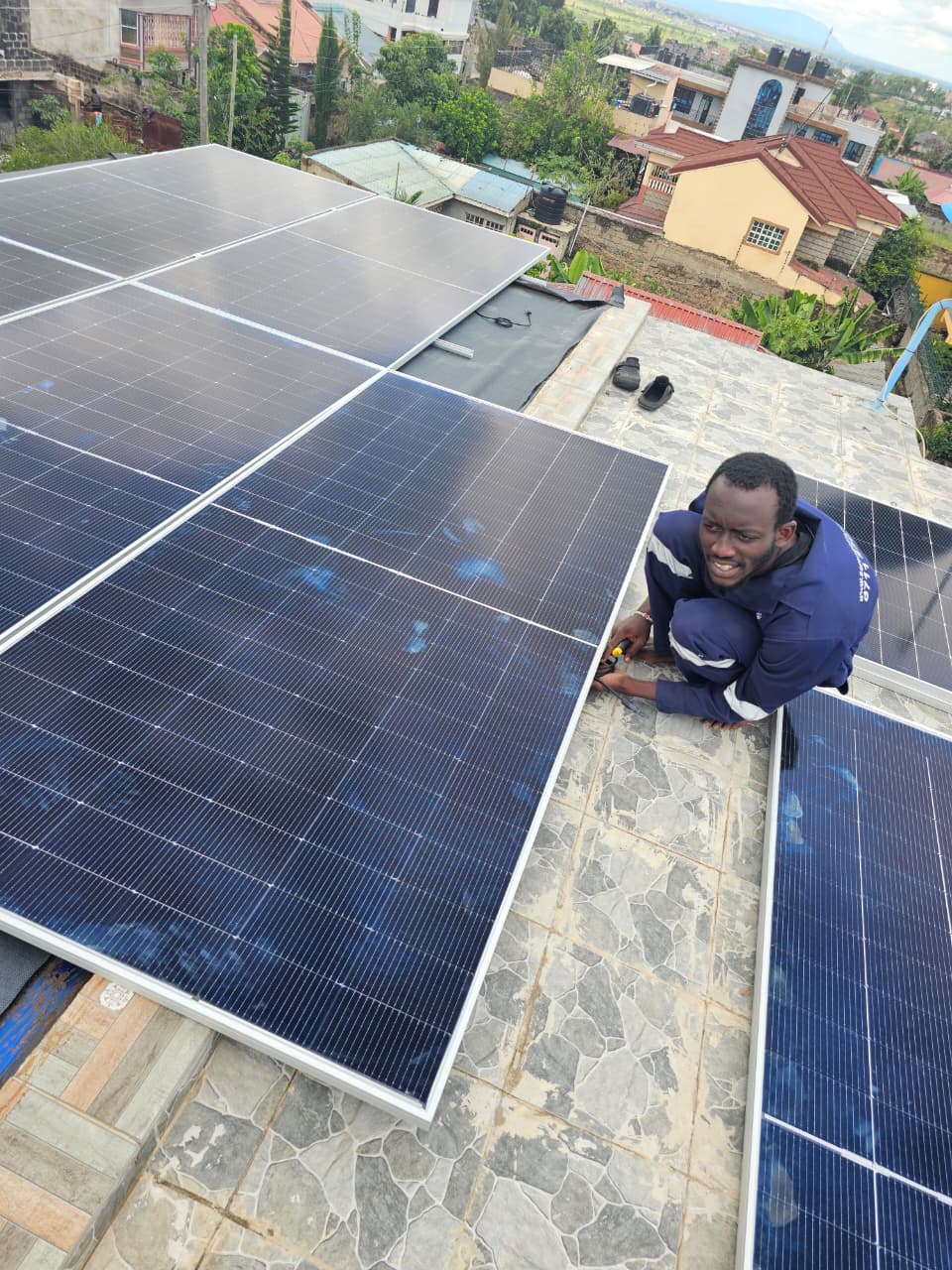 Sundara Africa founders with a solar dryer control unit prototype